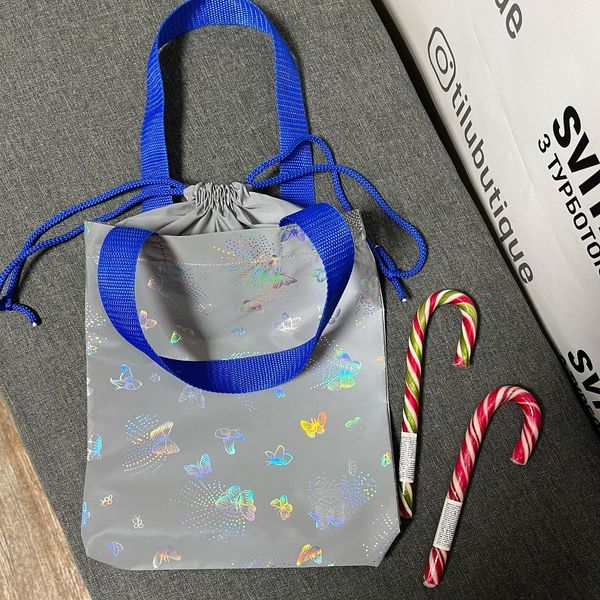 Reflective mini Svitashka shopper with ties, butterflies, blue handles