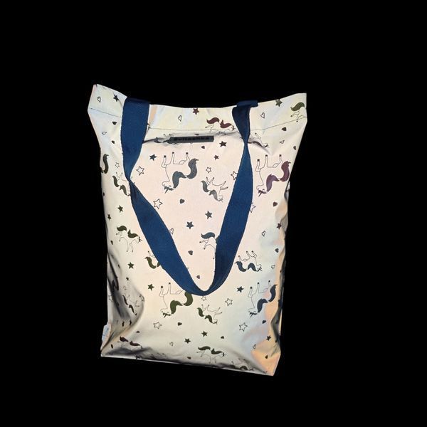Reflective Svitashka shopper Neon Unicorns on a magnetic button. Blue handles