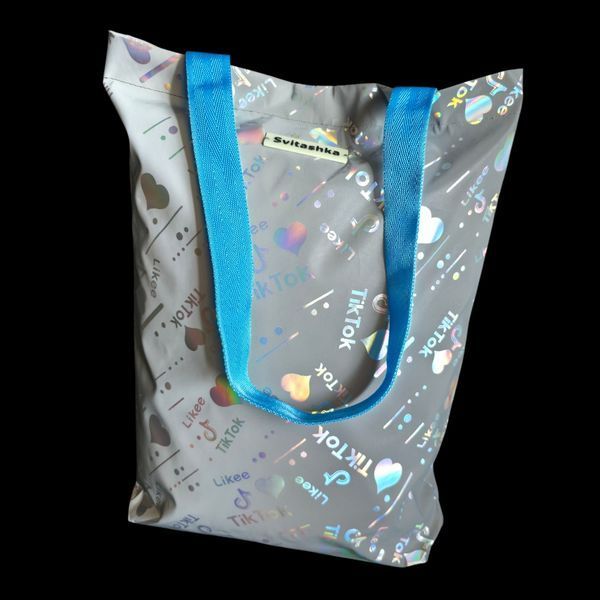 Reflective Svitashka Tiktok shopper with magnetic button. Blue handles