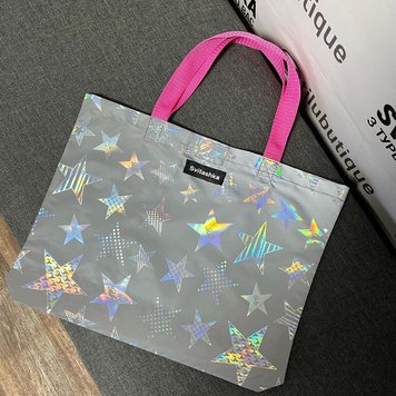 Svitashka stars reflective shopper with short pink handles on a magnetic button