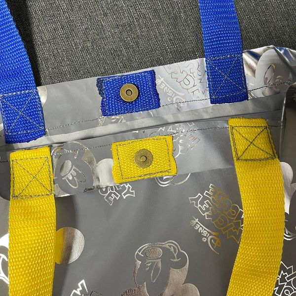 Svitashka Mickey reflective shopper bag with yellow and blue handles on the button